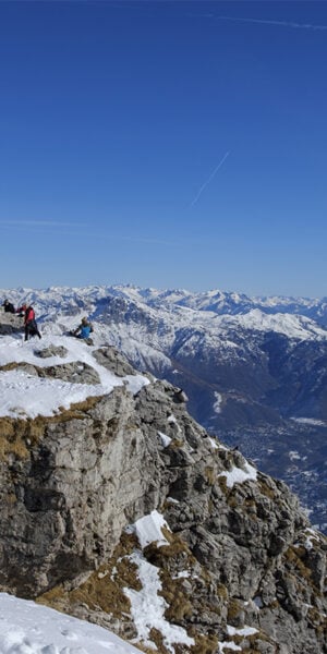 Alpinists are on the peak of the mountain