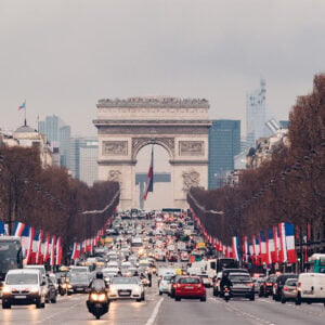 Cars driving along Avenue des Champs-Elysees to and from the Arc de Triomphe in Paris